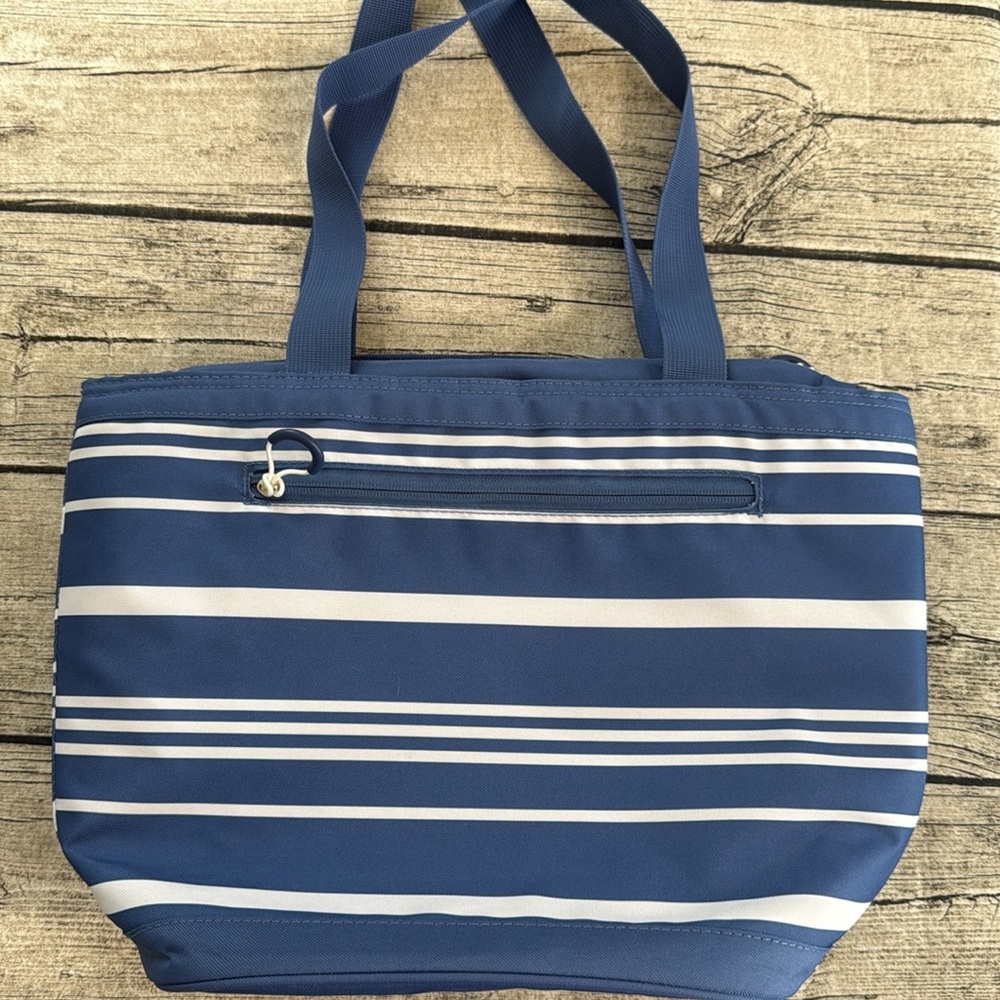Insulated bag tote in blue and white stripes.